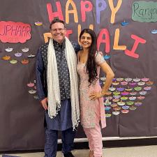 Two staff dressed in traditional attire to celebrate Diwali