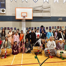 Middle school students gather in the gym after Diwali performance