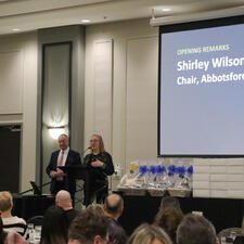 Board Chair Wilson is on stage with Superintendent Nosek, addresses the audience